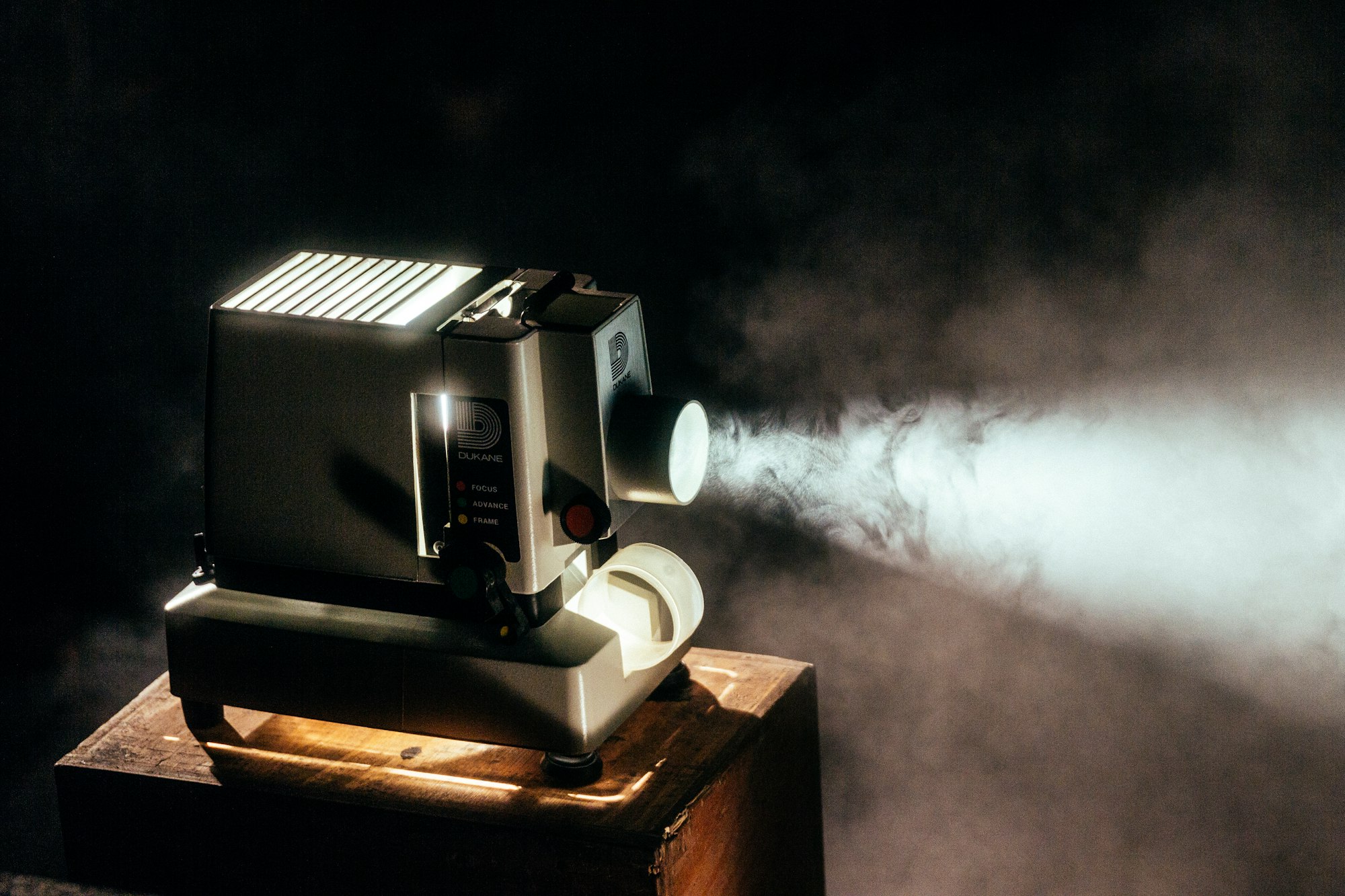 A film projector cutting a beam of light through the dark